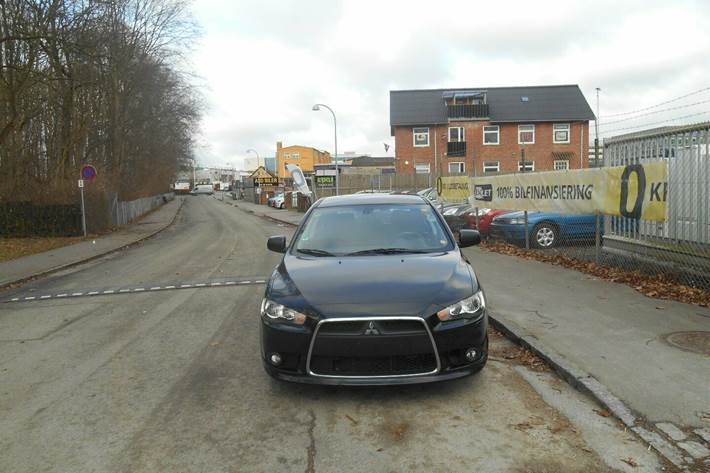 Grå Mitsubishi Lancer fra 2011