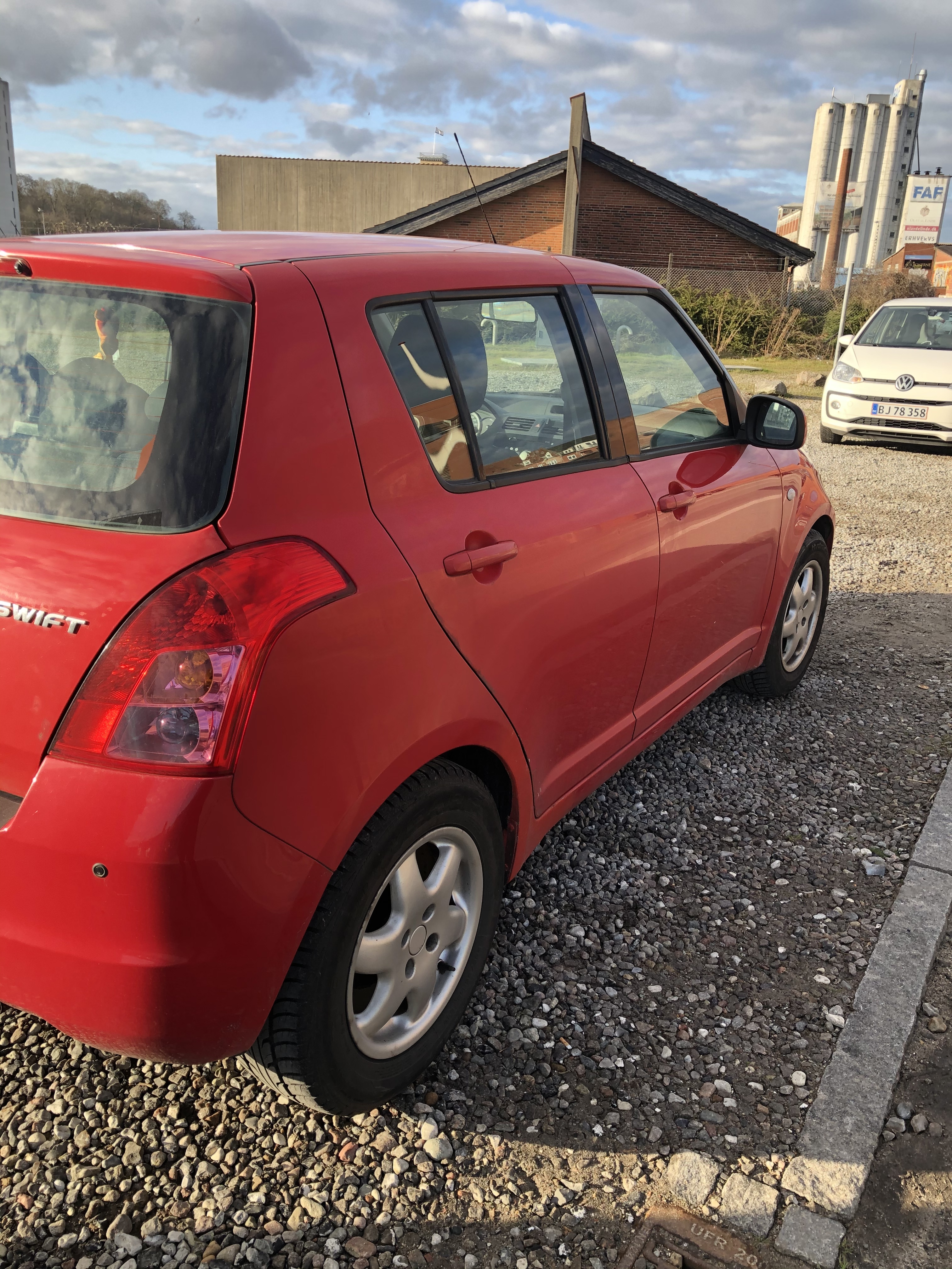 Rød Suzuki Swift fra 2008