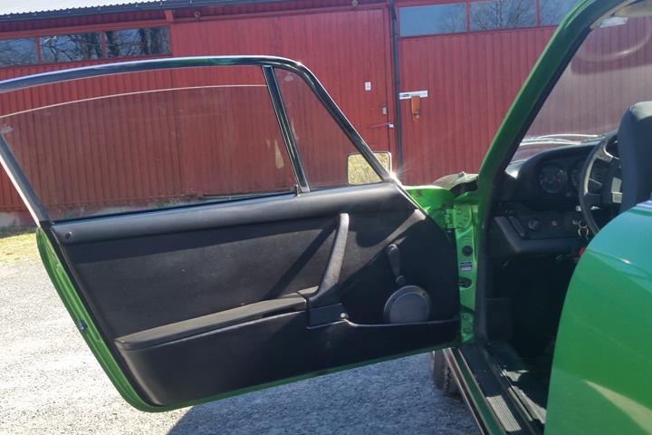 Grøn Porsche 911 fra 1975