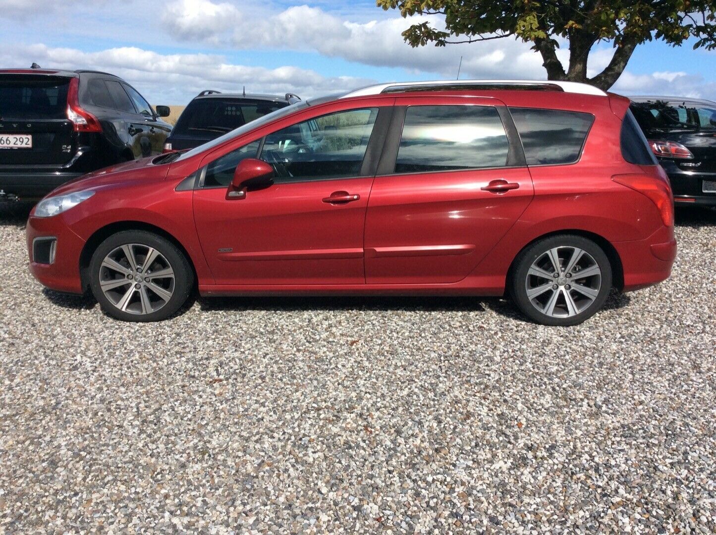 Rød Peugeot 308 fra 2013