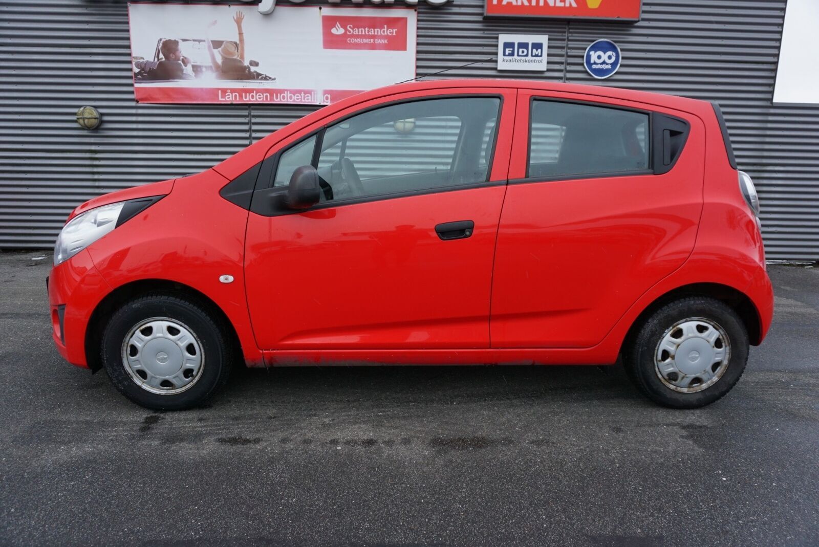 Rød Chevrolet Spark fra 2012