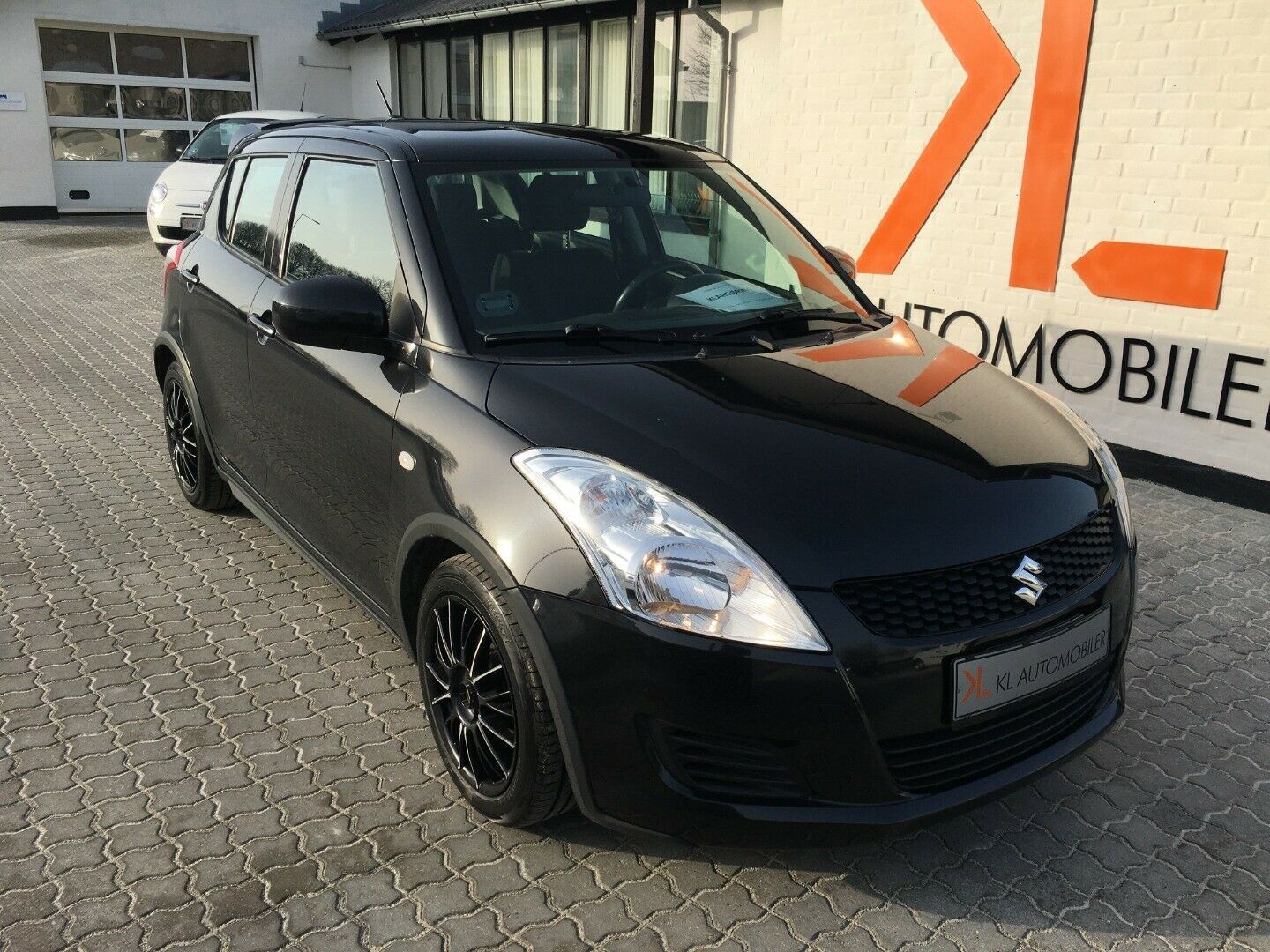 Grå Suzuki Swift fra 2012