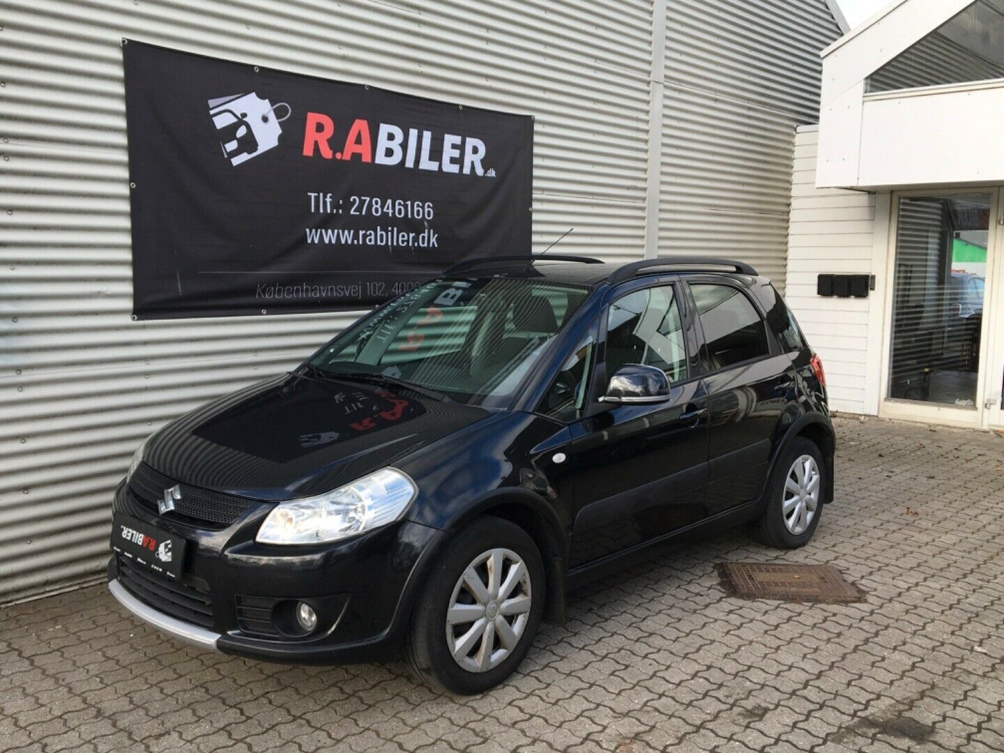 Grå Suzuki SX4 fra 2009