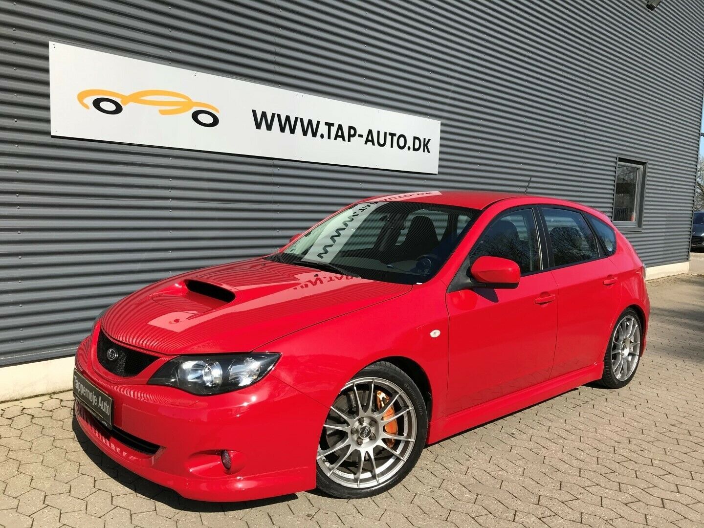 Rød Subaru Impreza fra 2008