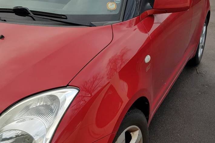 Rød Suzuki Swift fra 2007