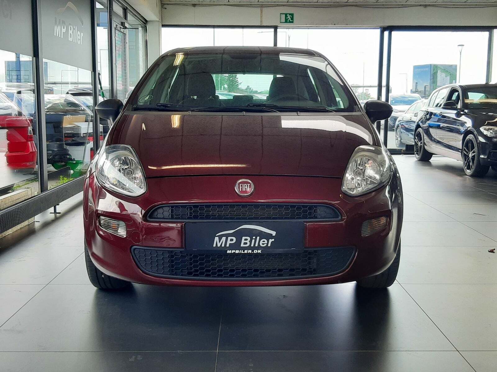 Rød Fiat Punto fra 2013