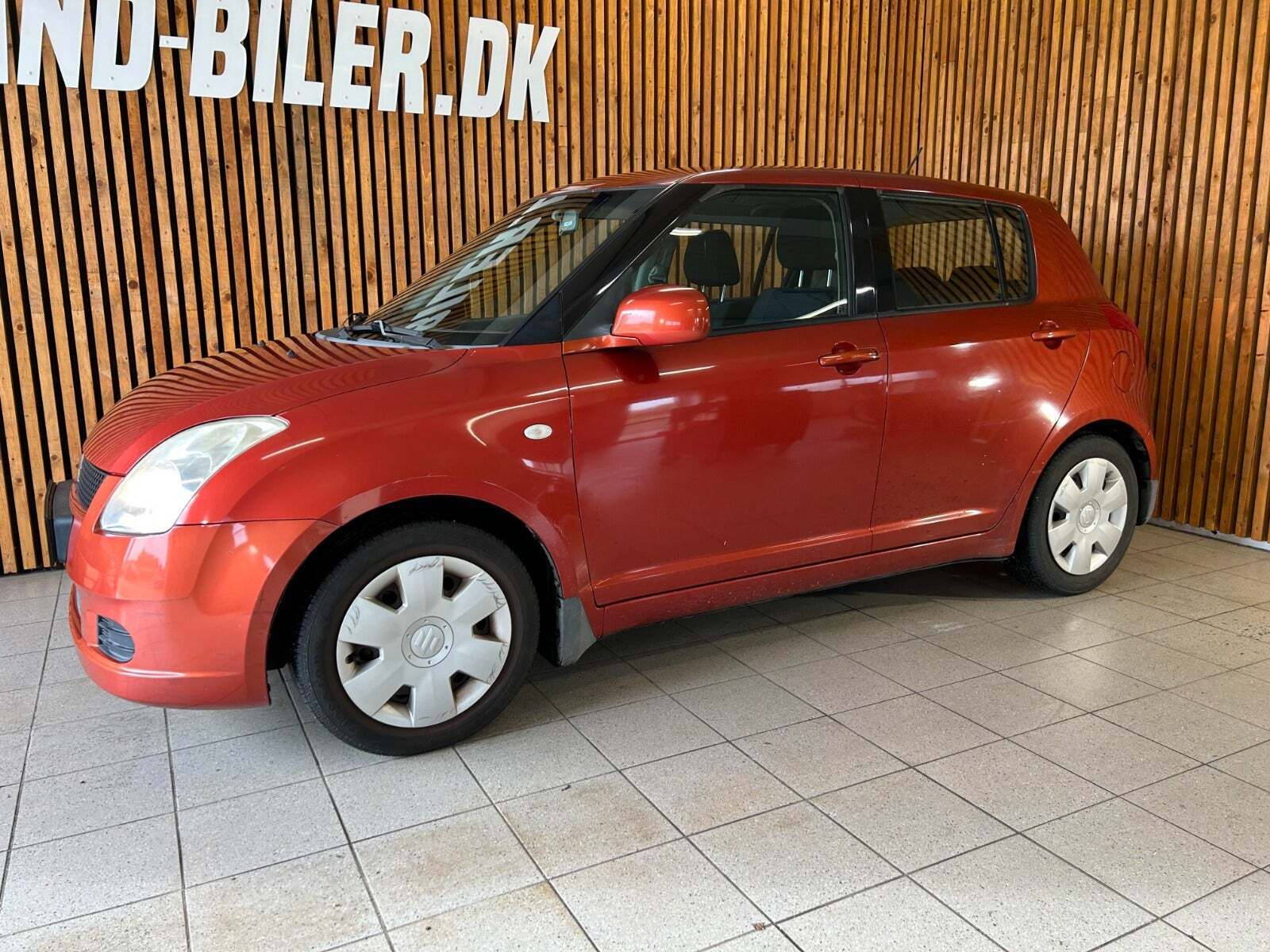 Orange Suzuki Swift fra 2007