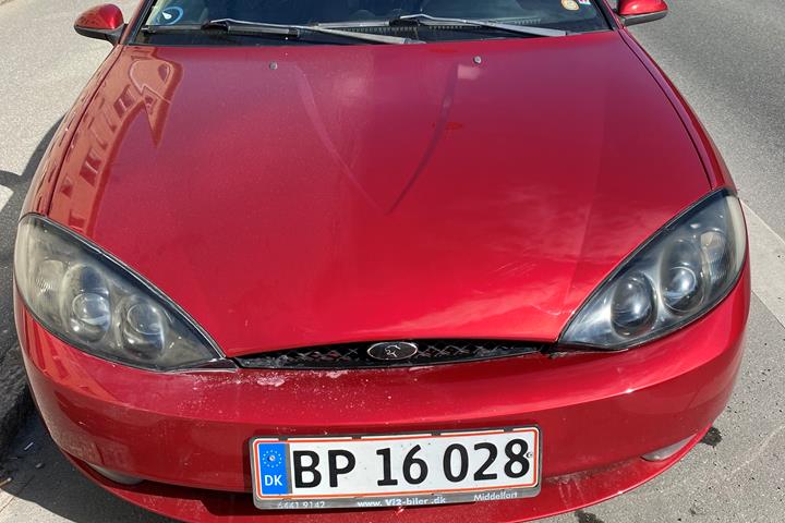 Rød Ford Cougar fra 1999