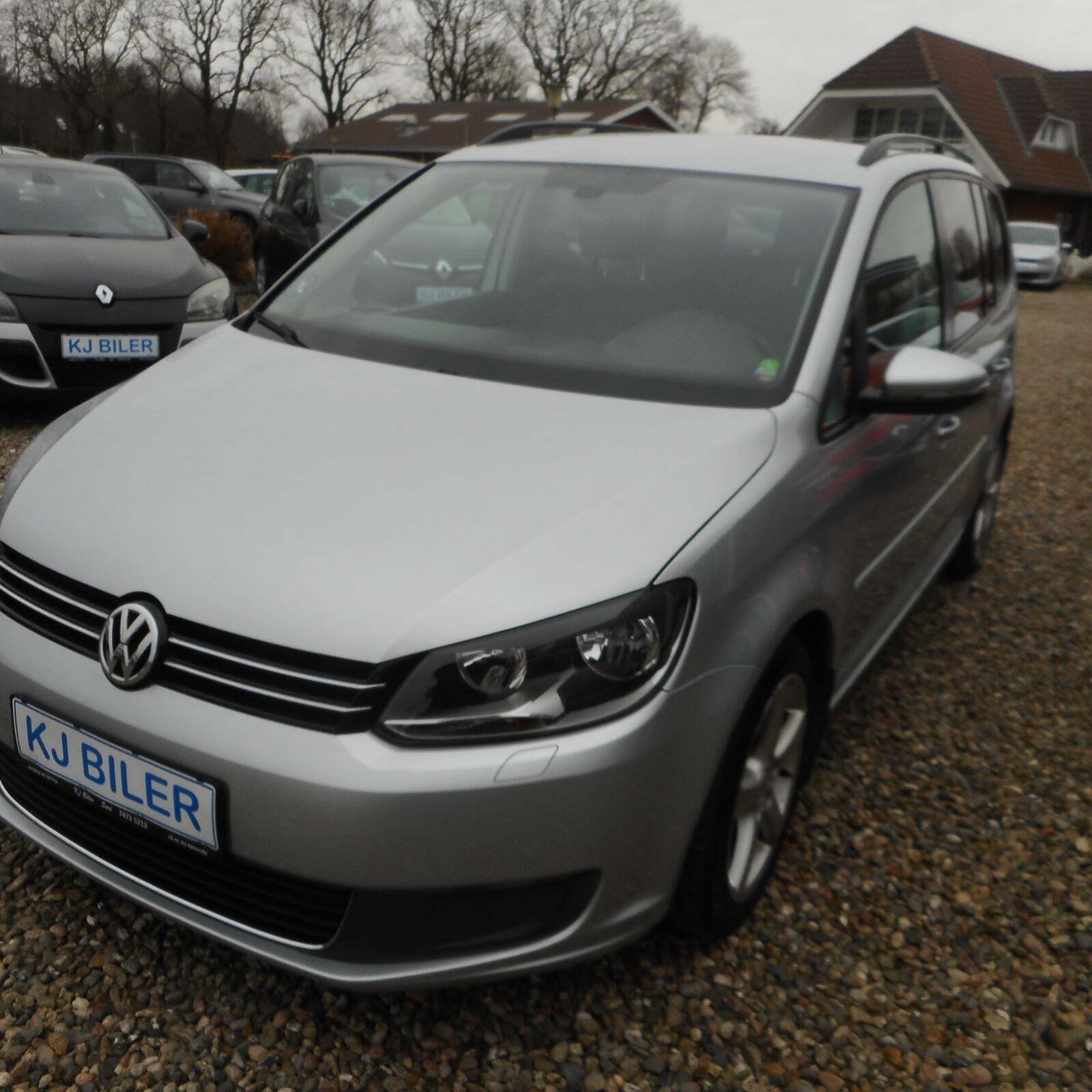 Sølv VW Touran fra 2014