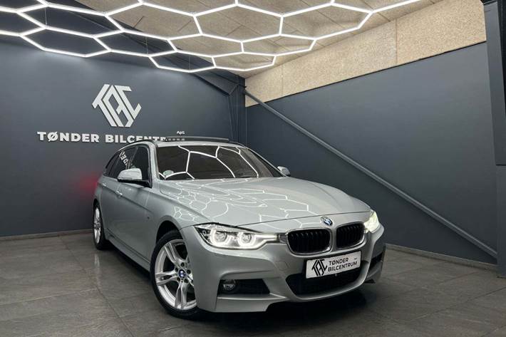 Sølv BMW 330d fra 2016 set udefra