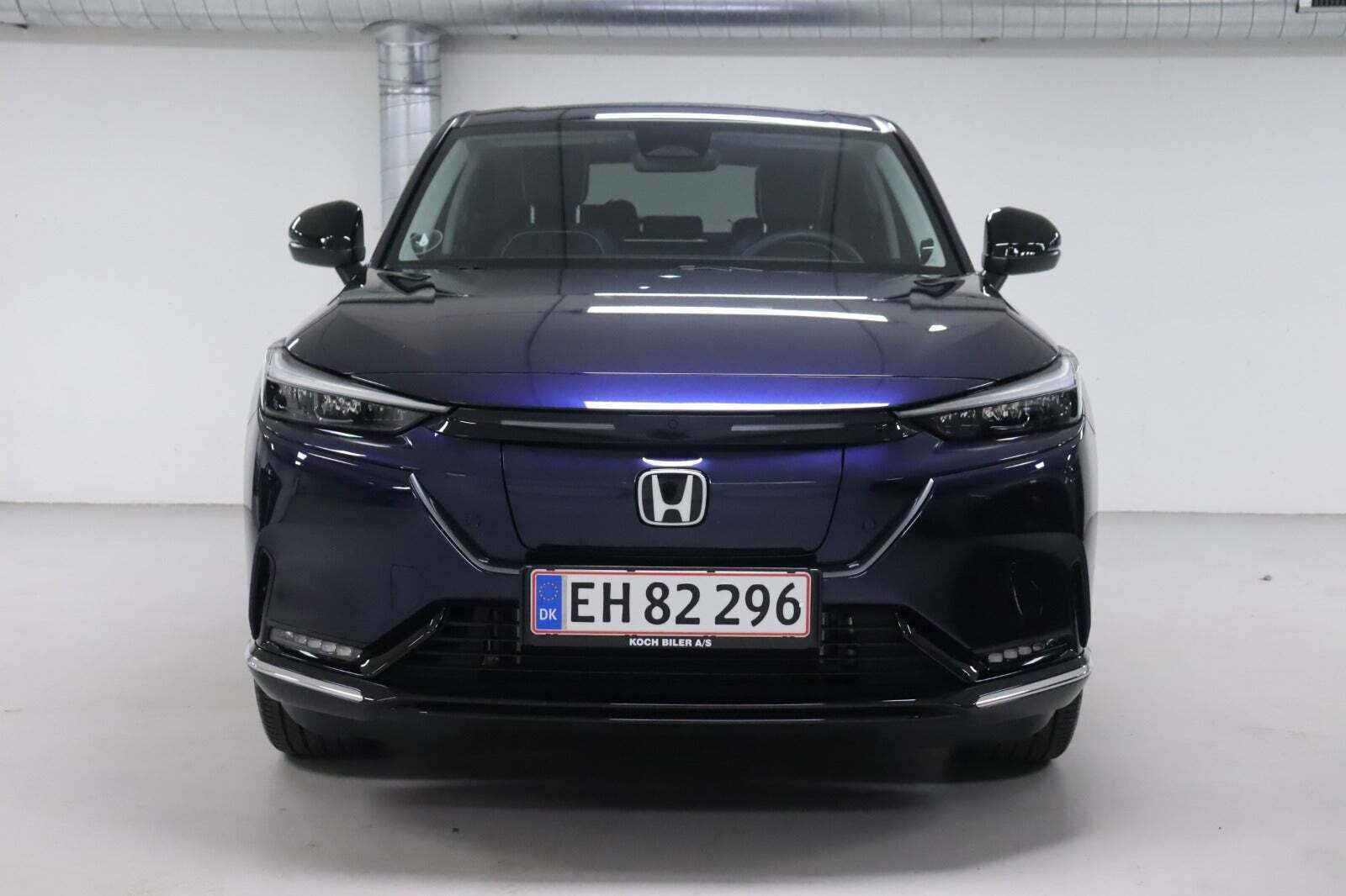 Blå Honda e:Ny1 fra 2024 set udefra
