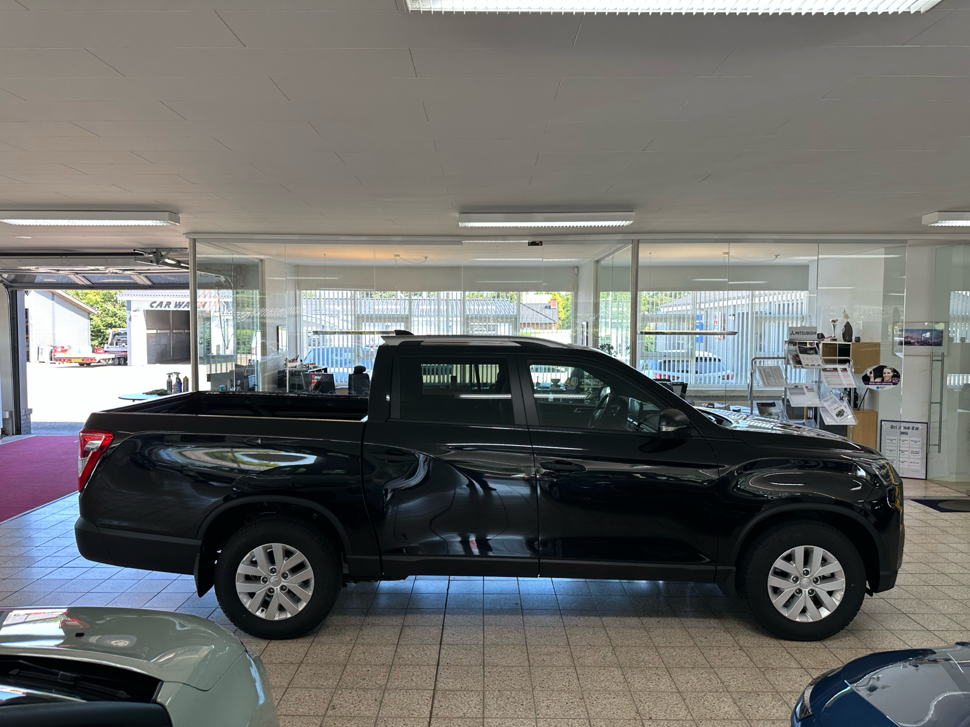 Sort KGM Musso Grand fra 2025