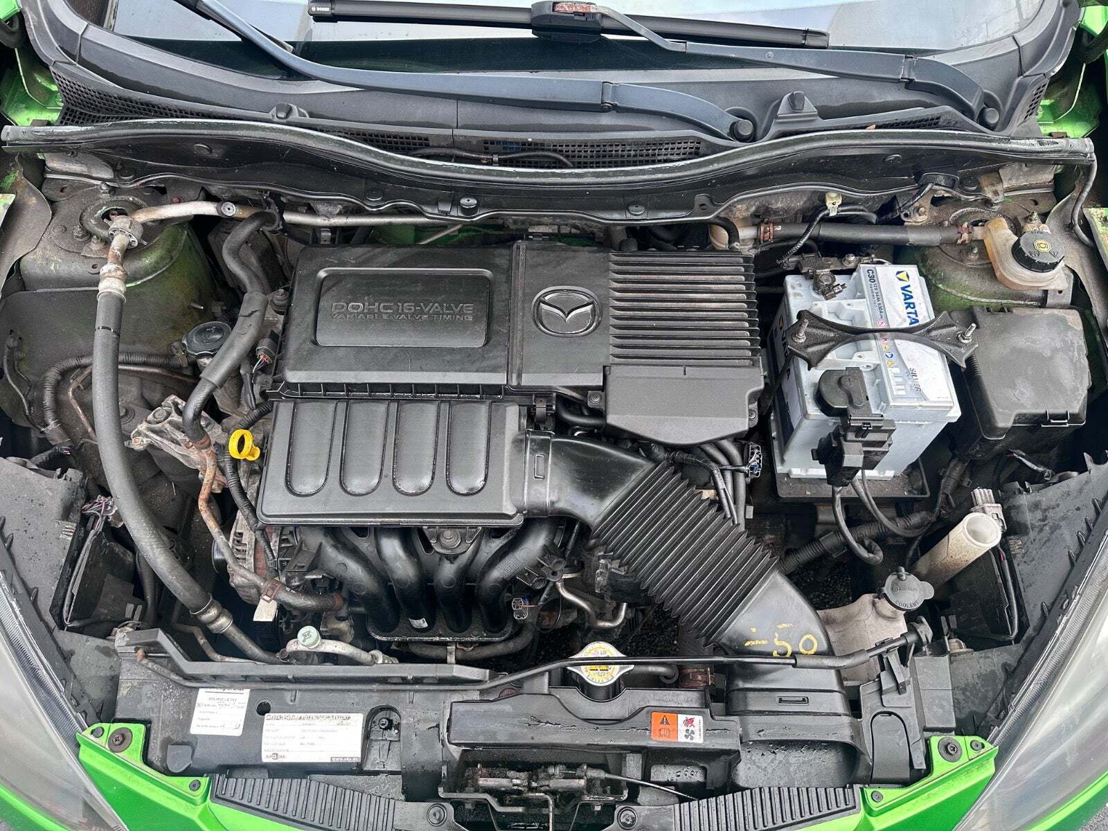 Grøn Mazda 2 fra 2011