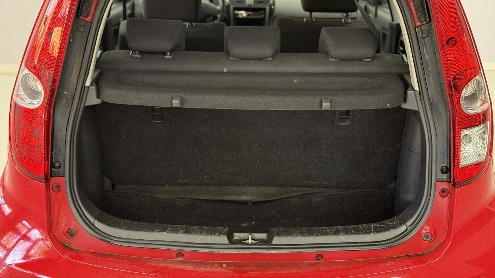 Rød Suzuki Splash fra 2011