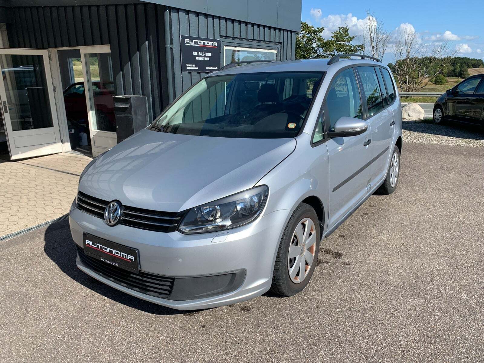 Sølv VW Touran fra 2013