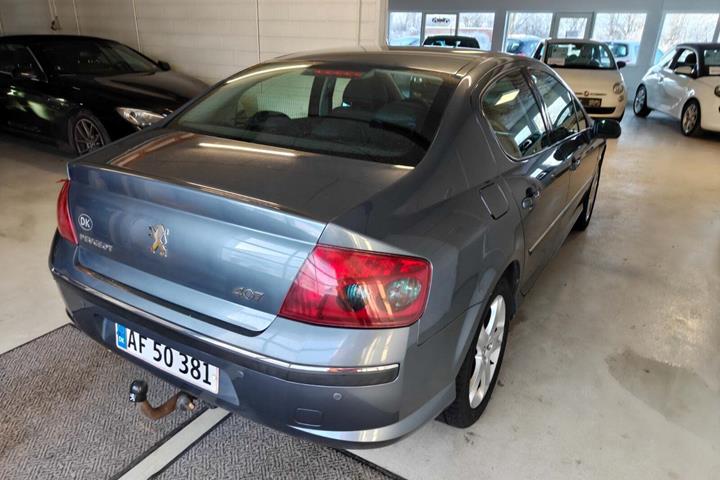 Gul Peugeot 407 fra 2007