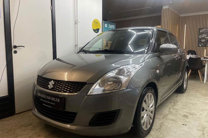 Grøn Suzuki Swift fra 2012 set udefra