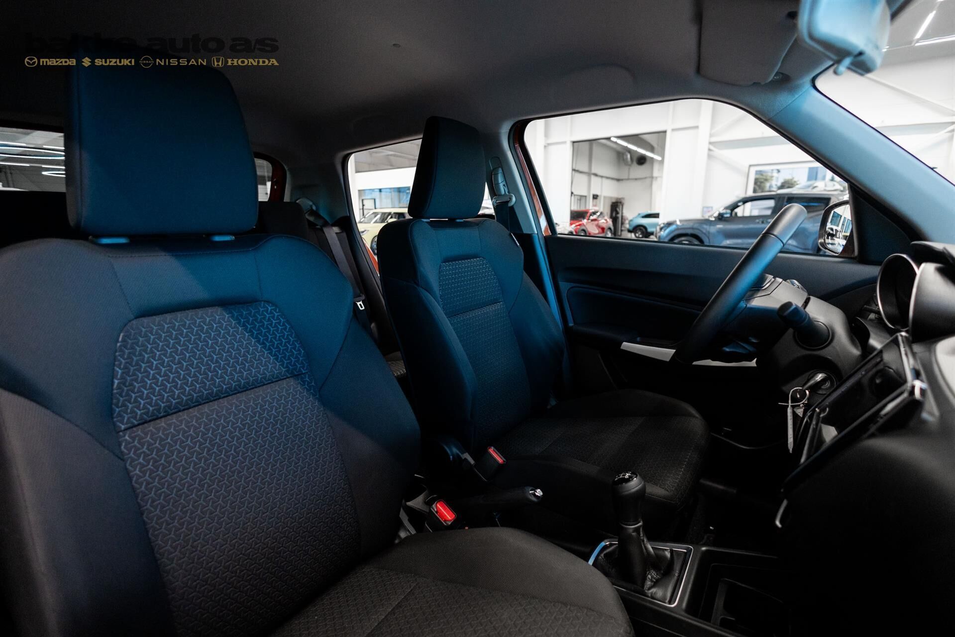 Orange Suzuki Swift fra 2023