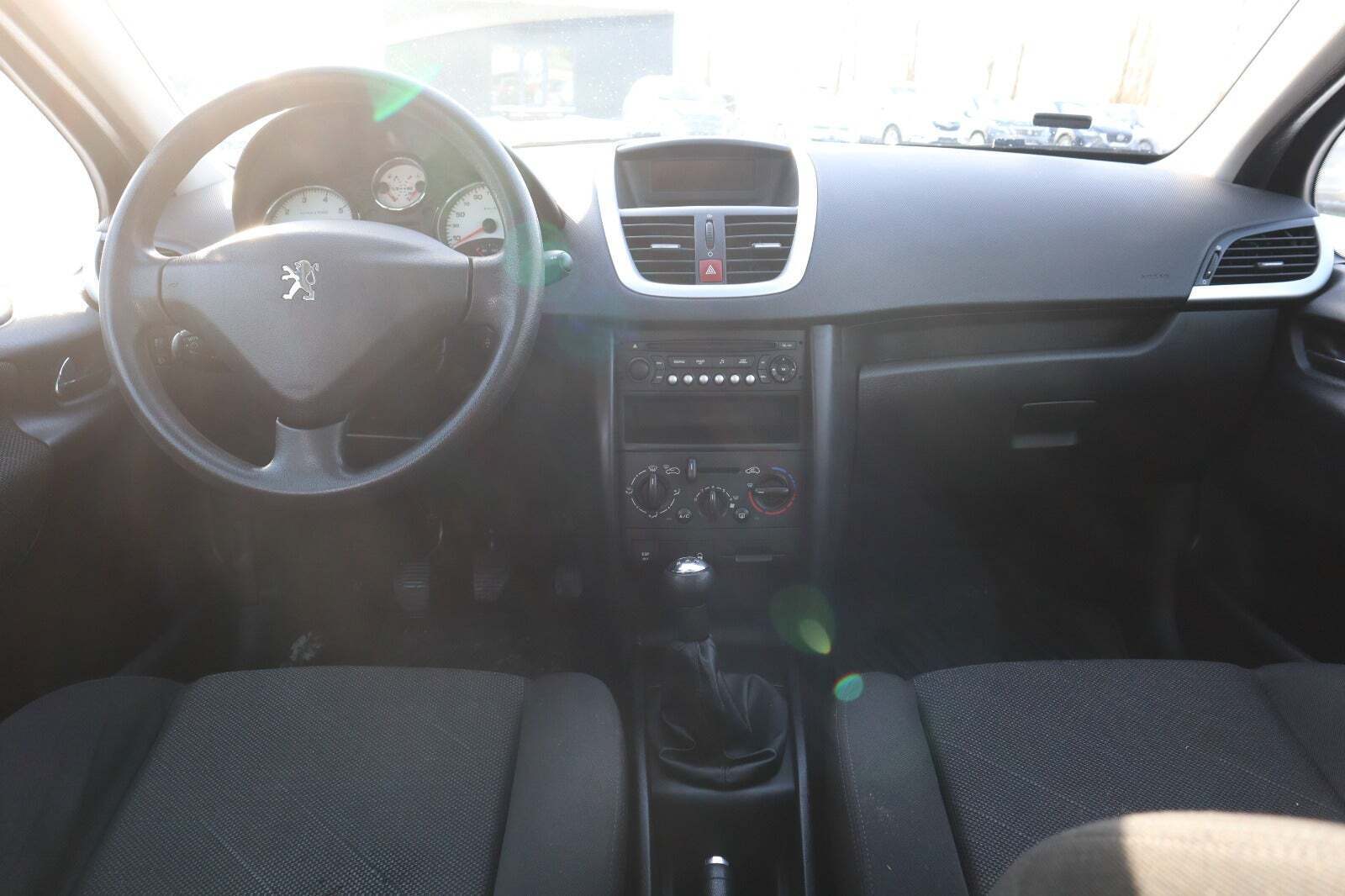 Orange Peugeot 207 fra 2009