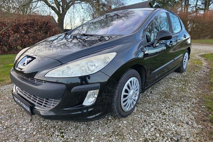 Brun Peugeot 308 fra 2009