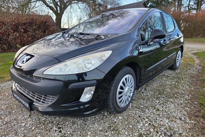 Brun Peugeot 308 fra 2009