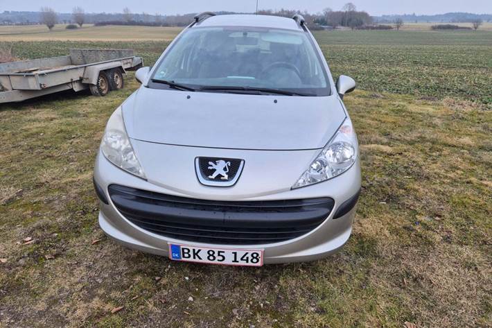 Orange Peugeot 207 fra 2009