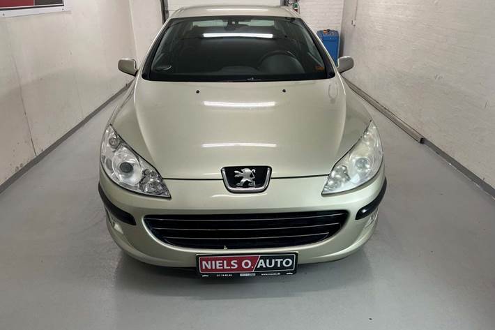 Orange Peugeot 407 fra 2006