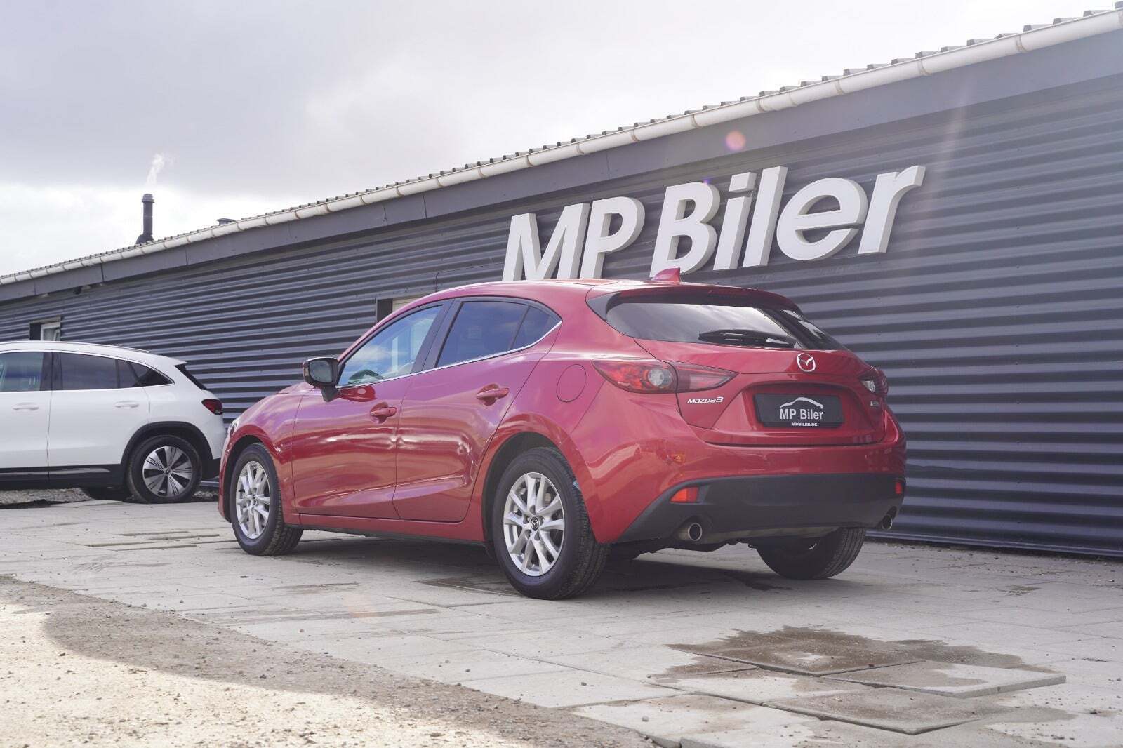 Rød Mazda 3 fra 2013