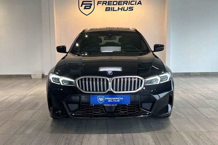Sort BMW 330e fra 2023