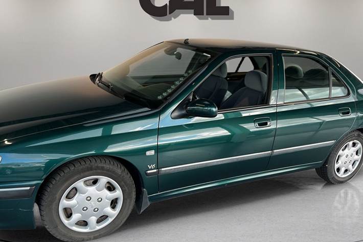 Grøn Peugeot 406 fra 1999