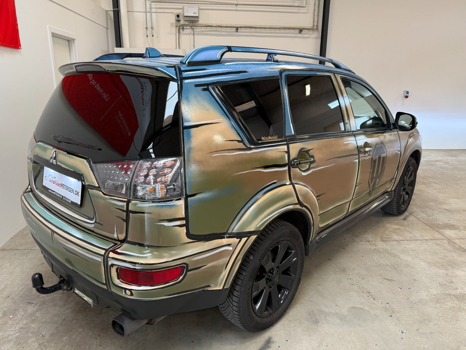 Brun Mitsubishi Outlander fra 2010