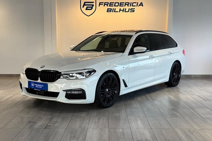 Beige BMW 520d fra 2017 set udefra