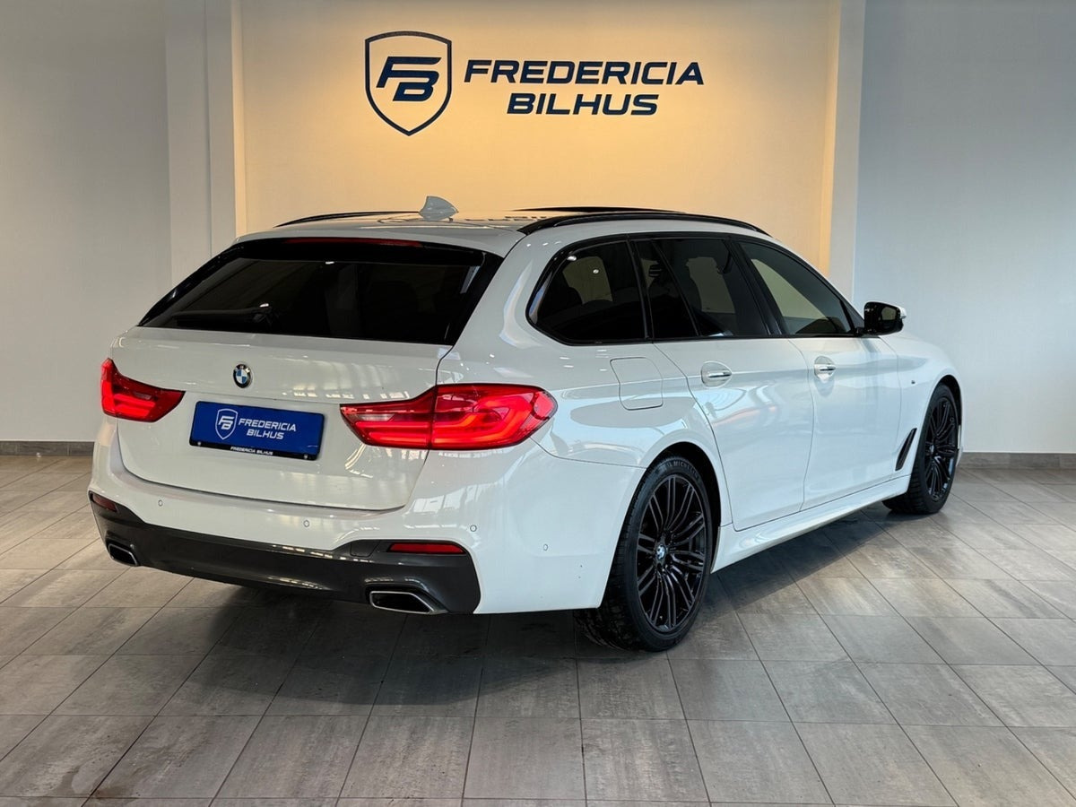 Beige BMW 520d fra 2017