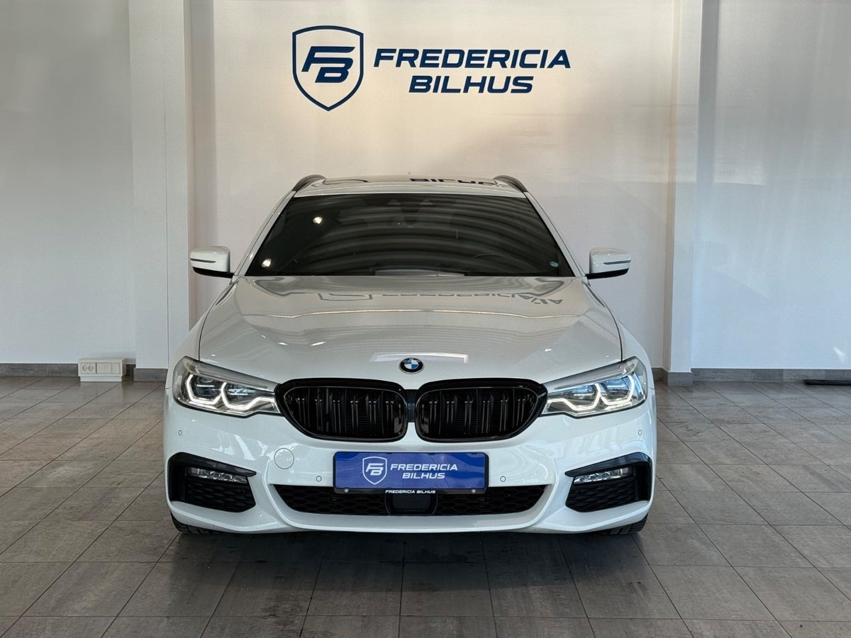 Beige BMW 520d fra 2017