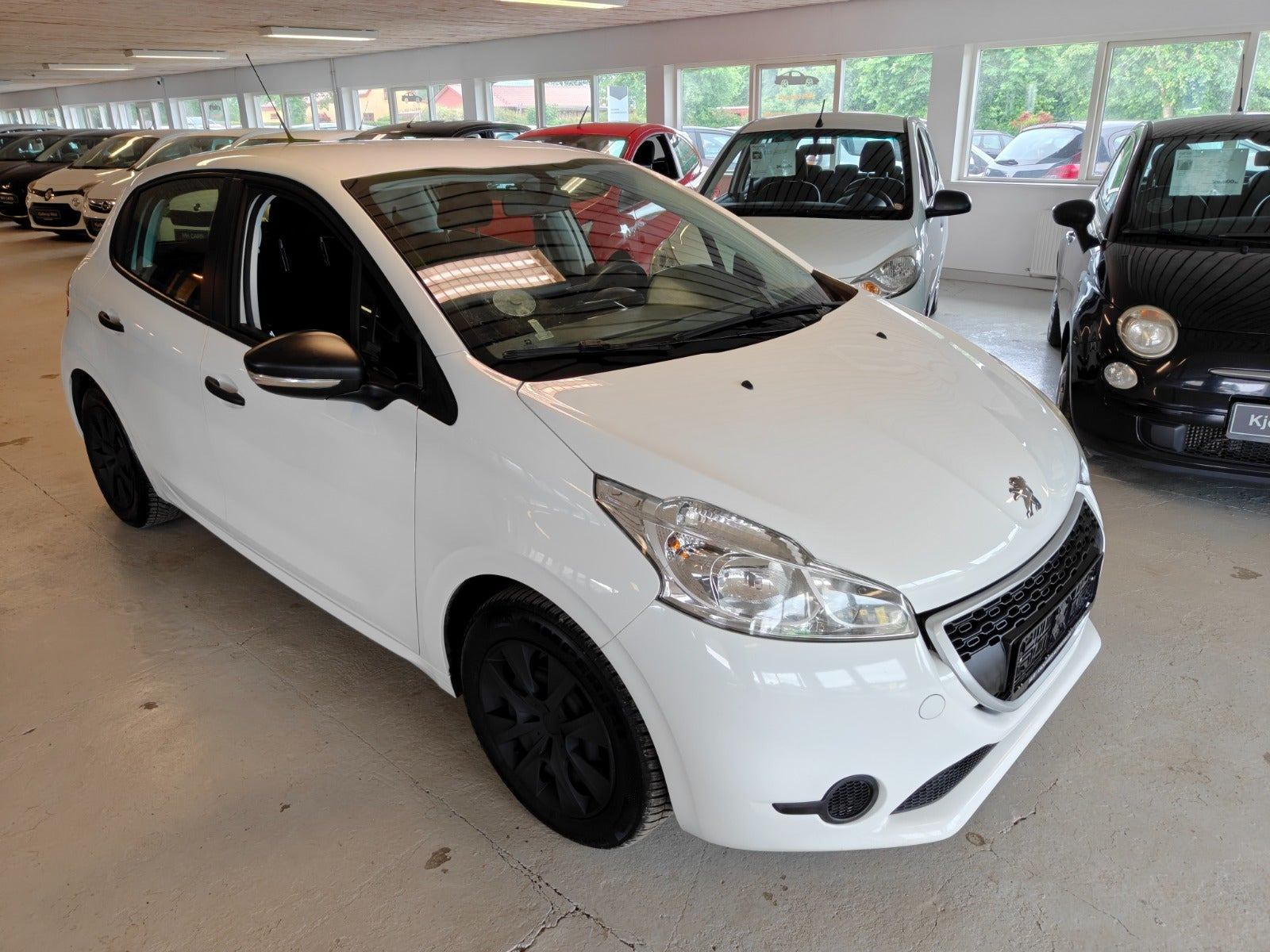Gul Peugeot 208 fra 2014