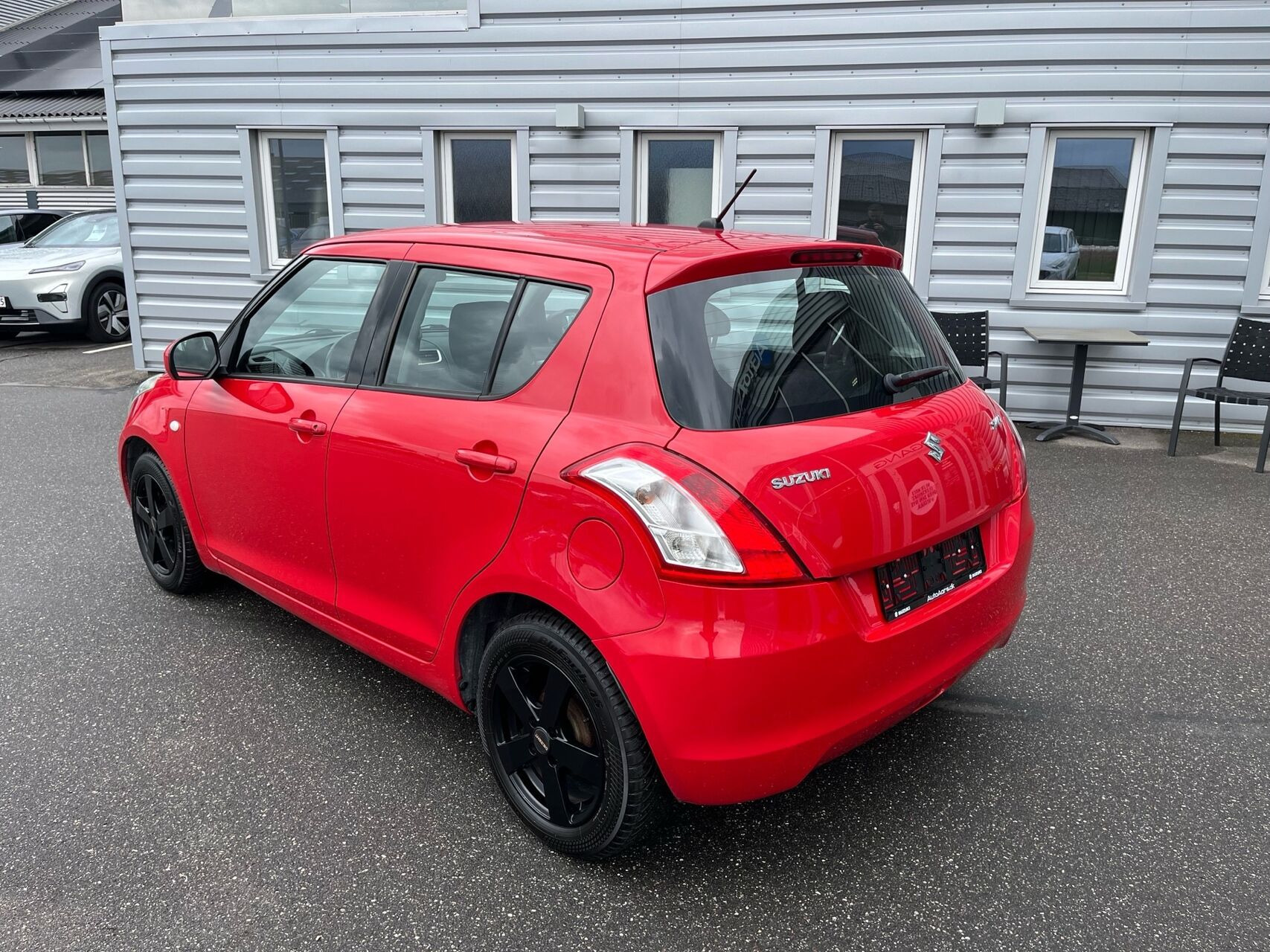 Rød Suzuki Swift fra 2014