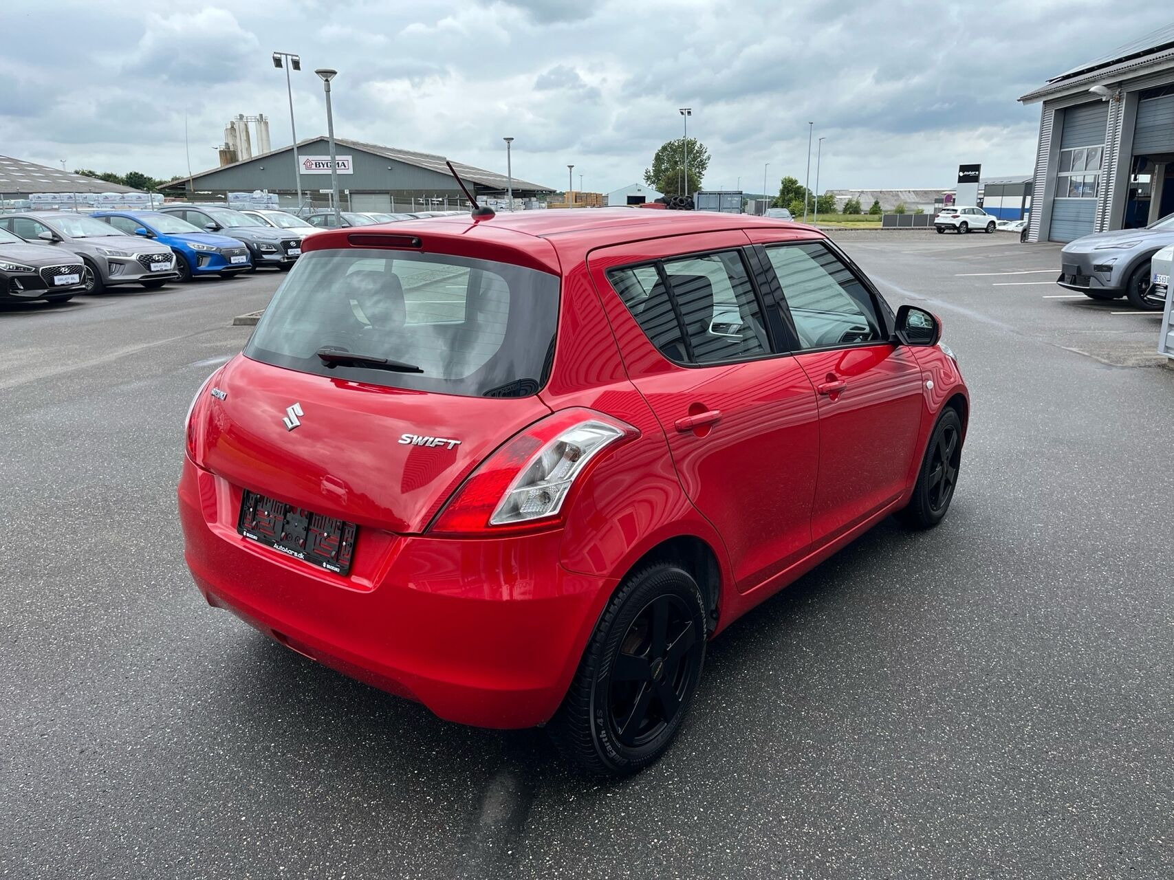 Rød Suzuki Swift fra 2014