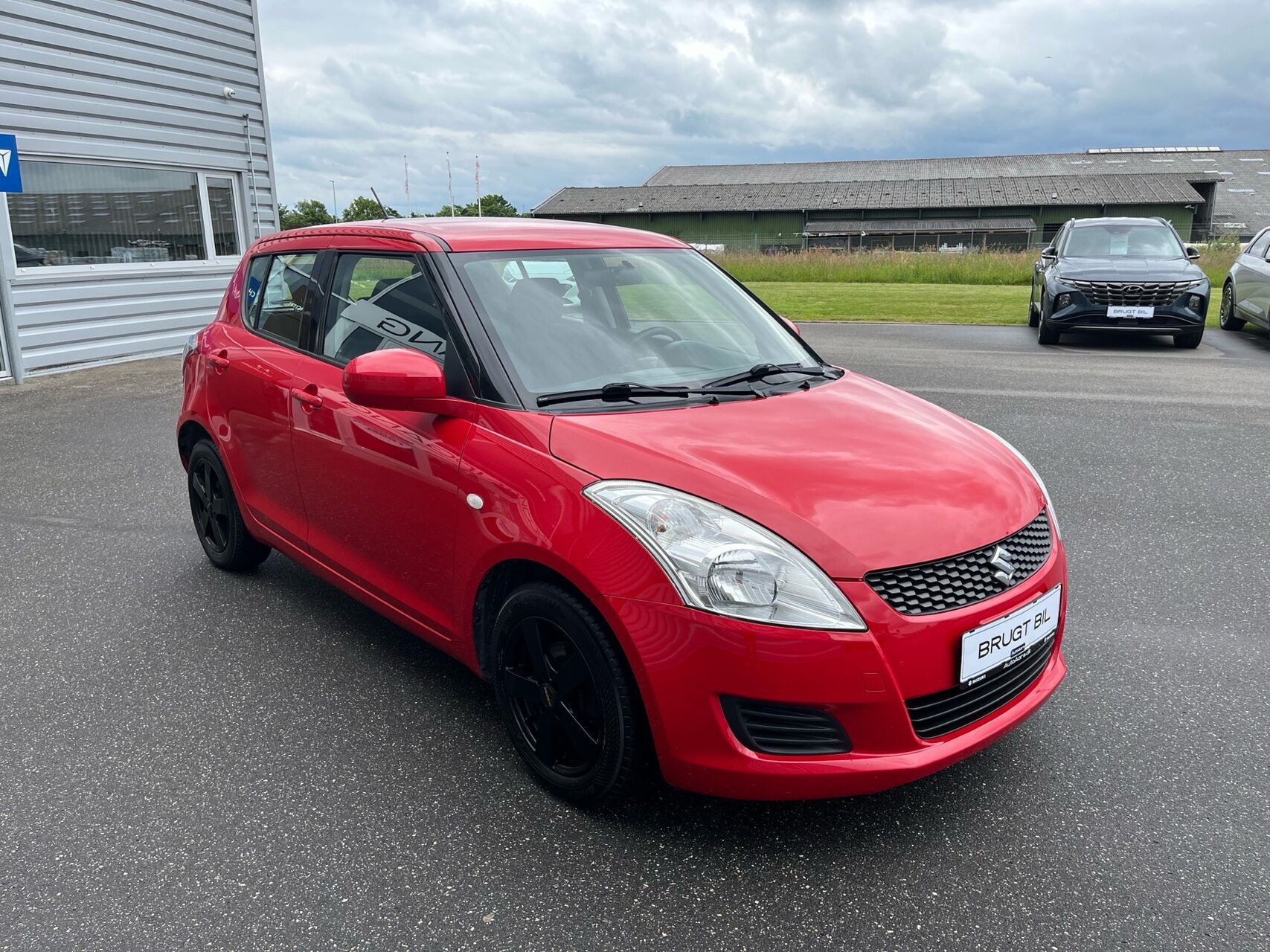 Rød Suzuki Swift fra 2014