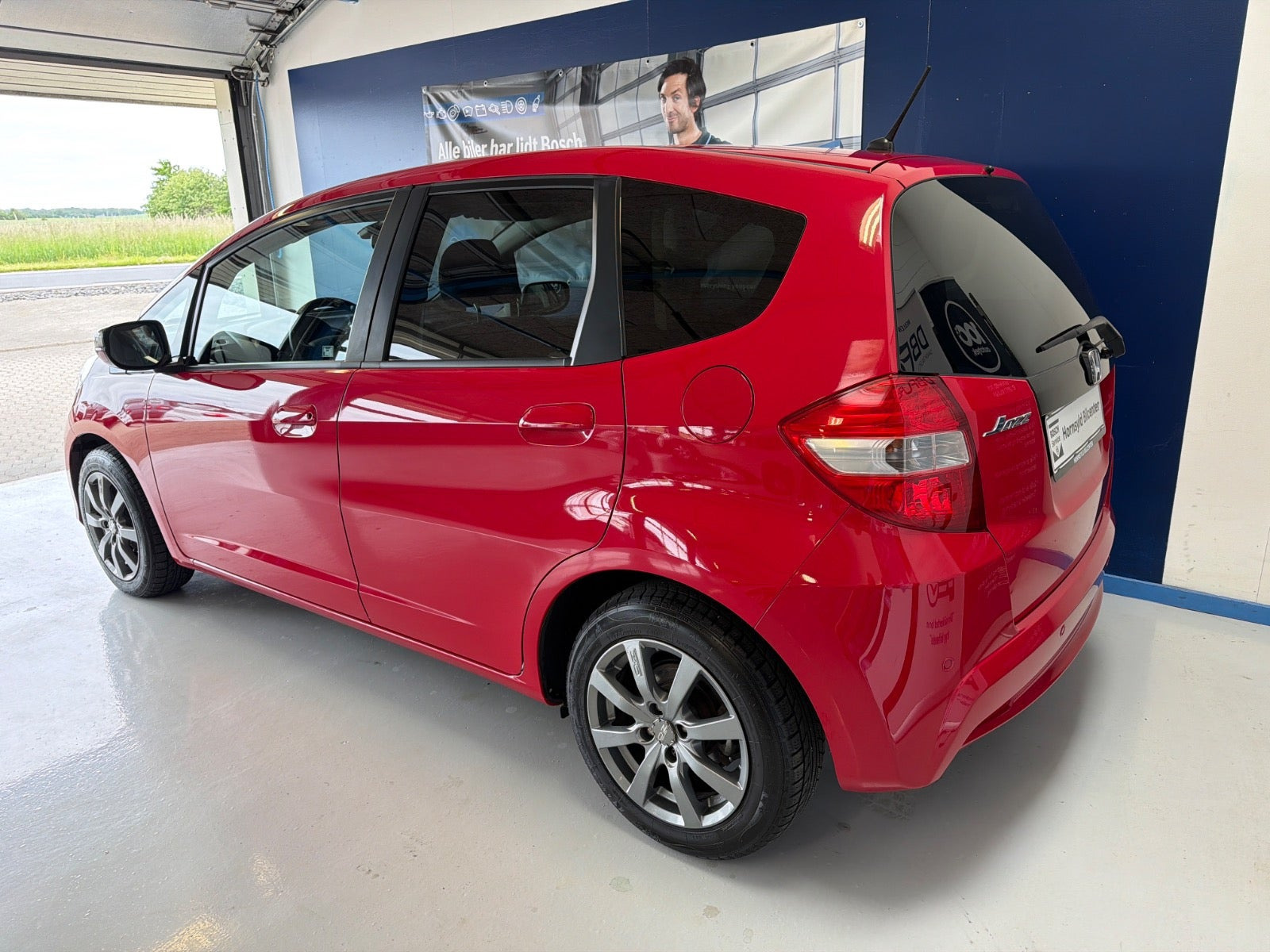 Rød Honda Jazz fra 2011
