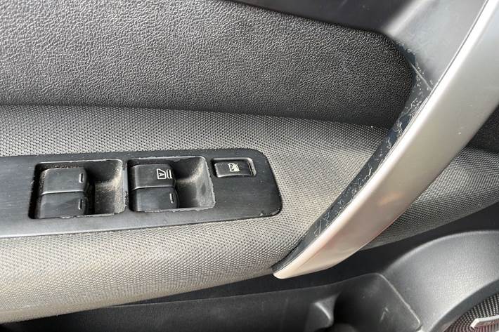 Rød Nissan Qashqai+2 fra 2012