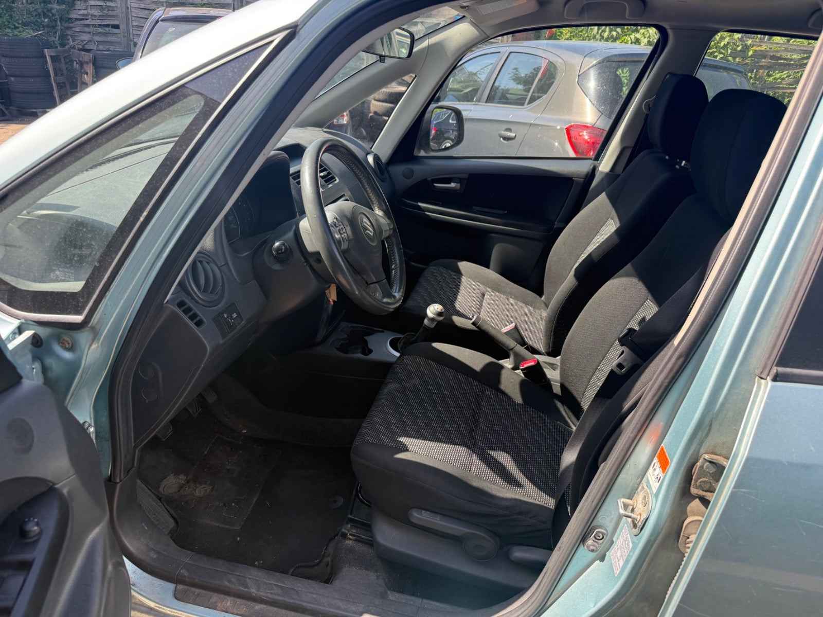 Blå Suzuki SX4 fra 2008