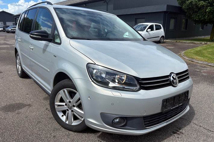 Sølv VW Touran fra 2013