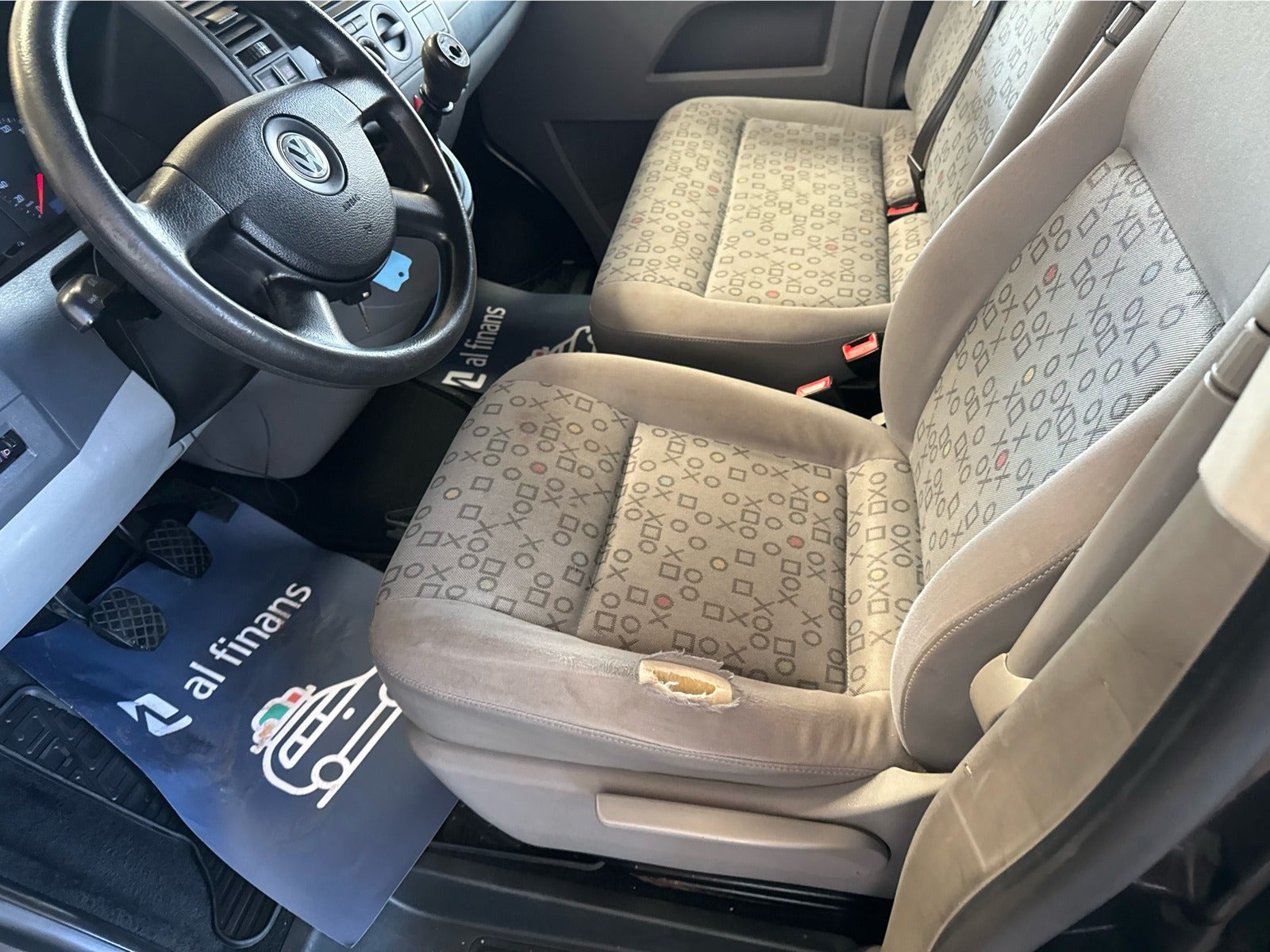 Blå VW Caravelle fra 2009