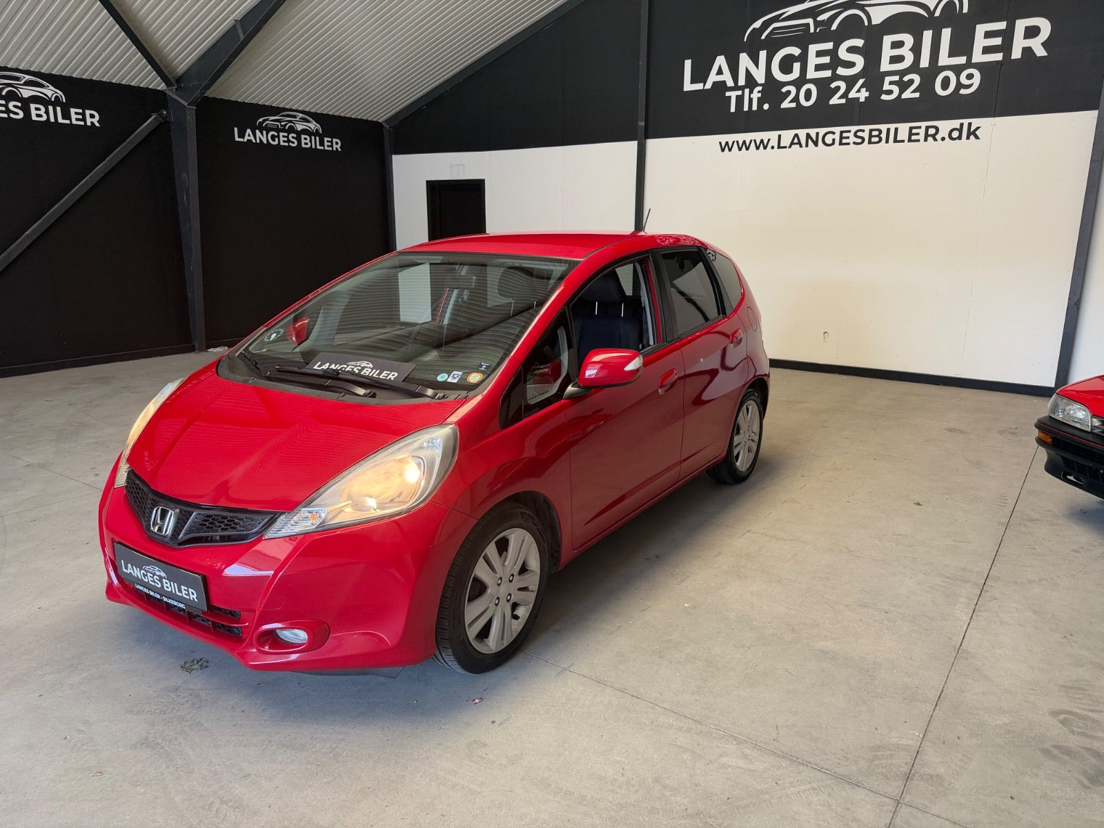 Rød Honda Jazz fra 2014
