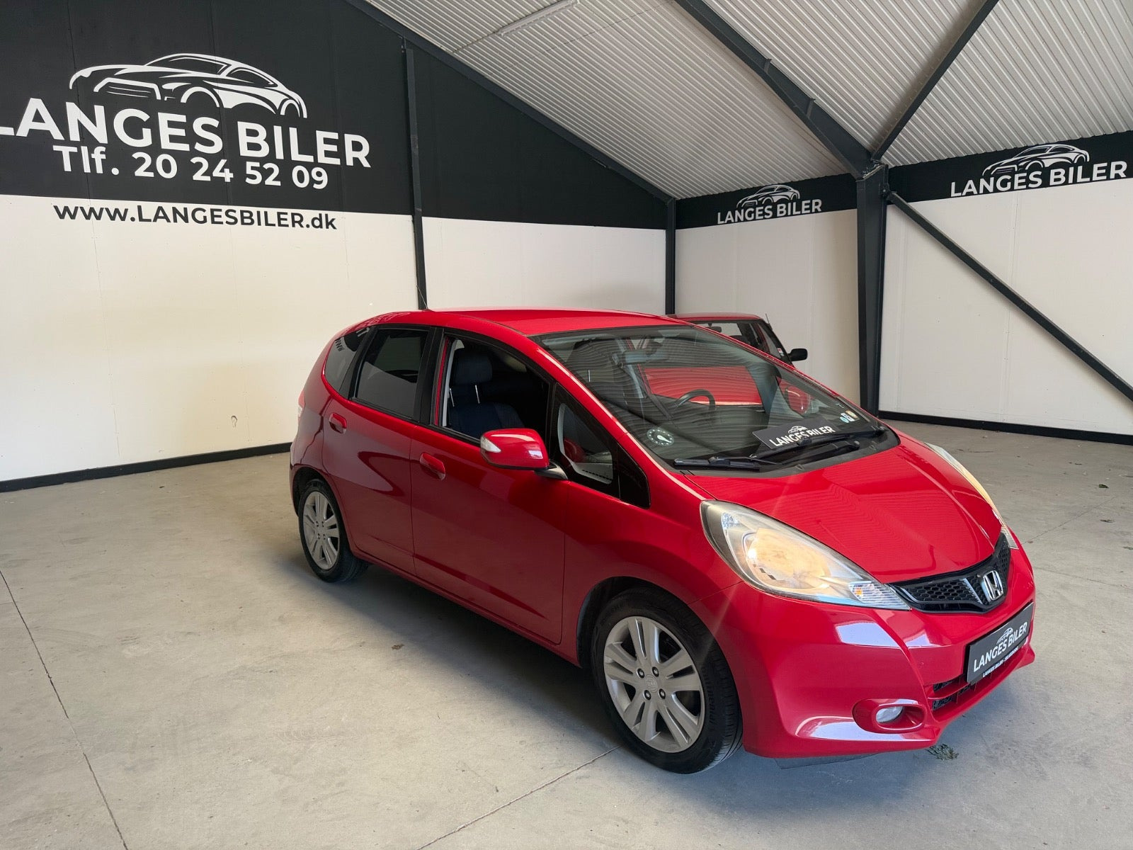 Rød Honda Jazz fra 2014