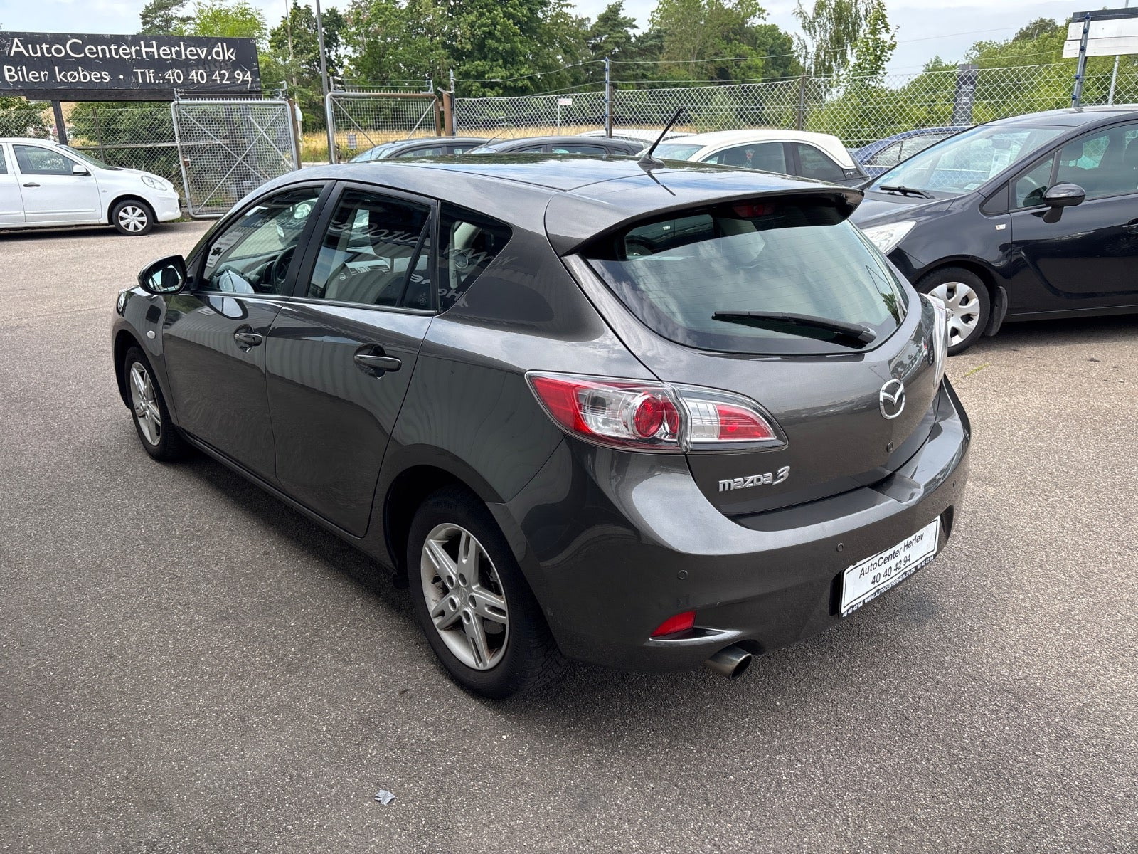 Grå Mazda 3 fra 2012