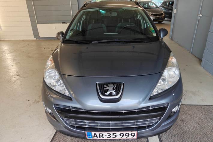 Gul Peugeot 207 fra 2011