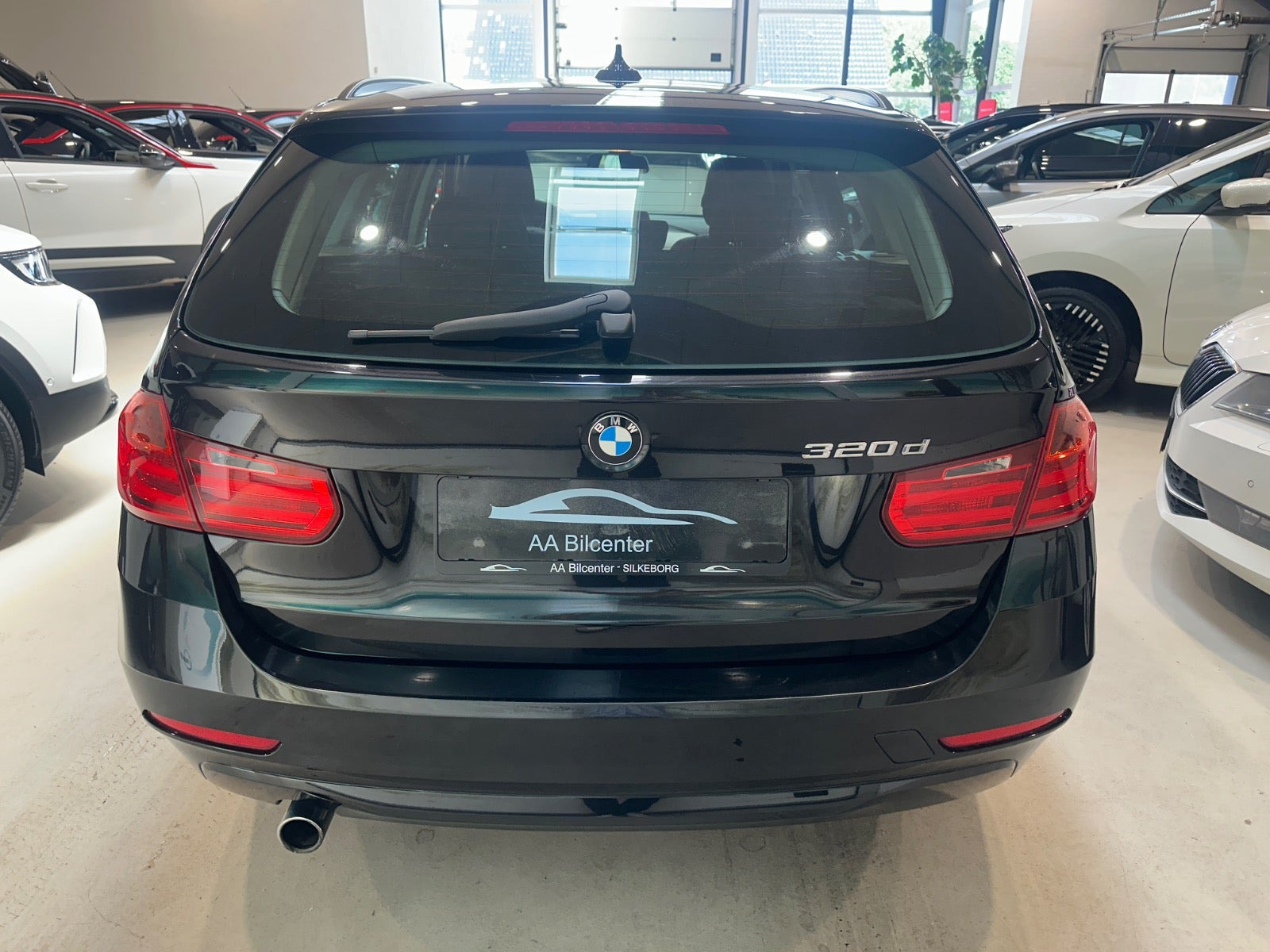 Sort BMW 320d fra 2013