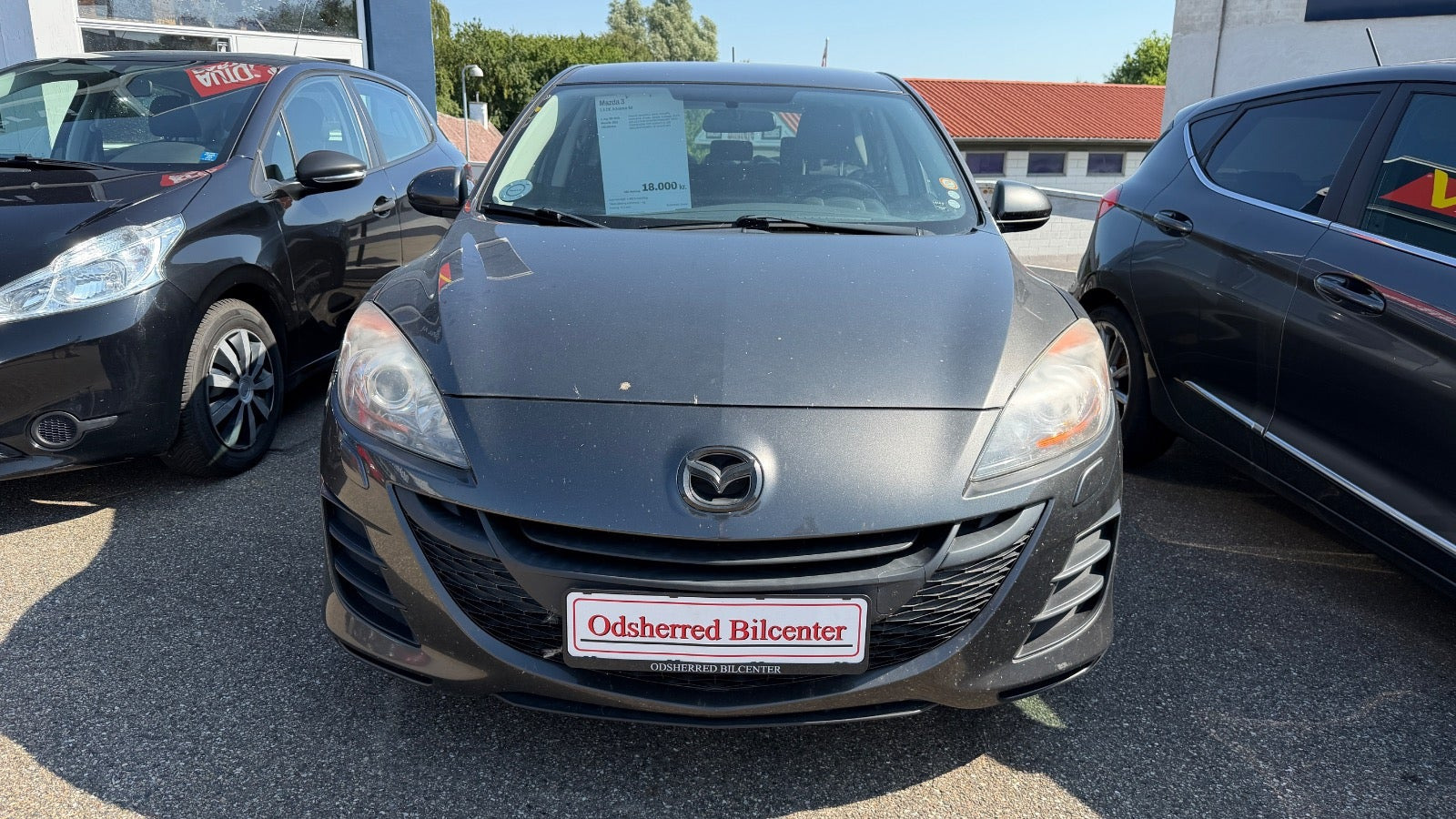 Grå Mazda 3 fra 2010