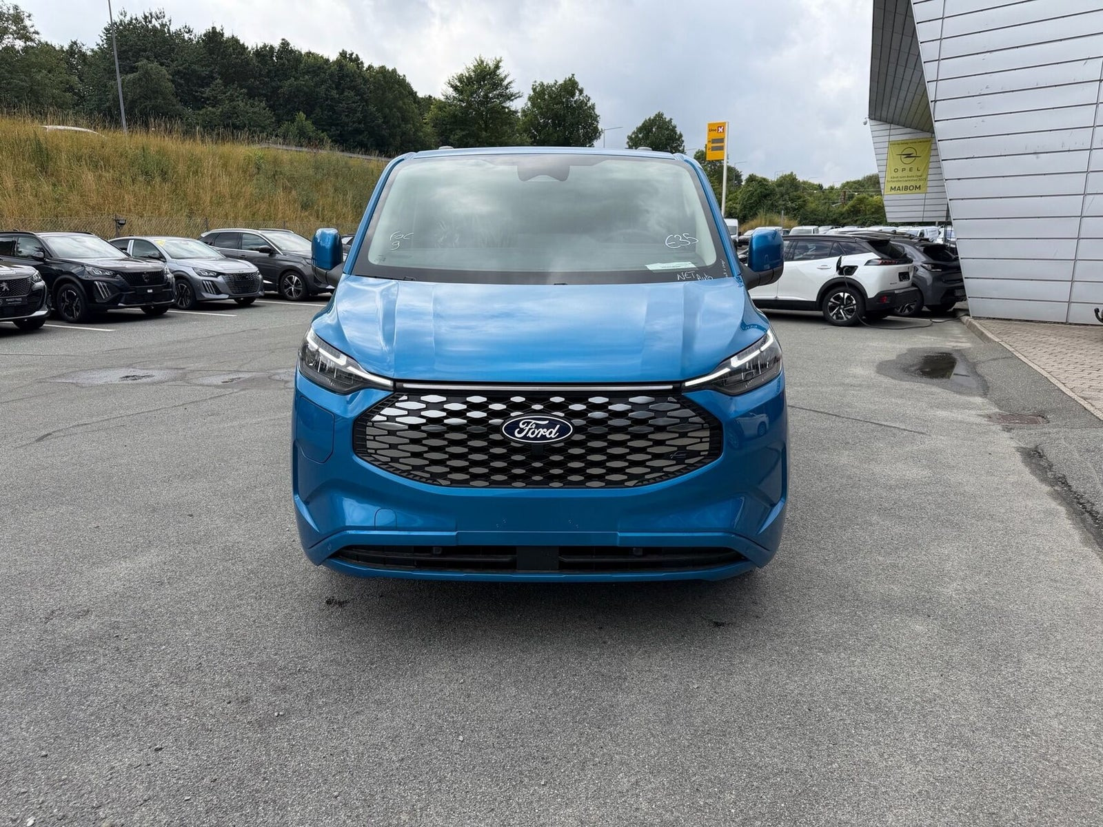 Blå Ford E-Transit Custom 320 L1 fra 2026